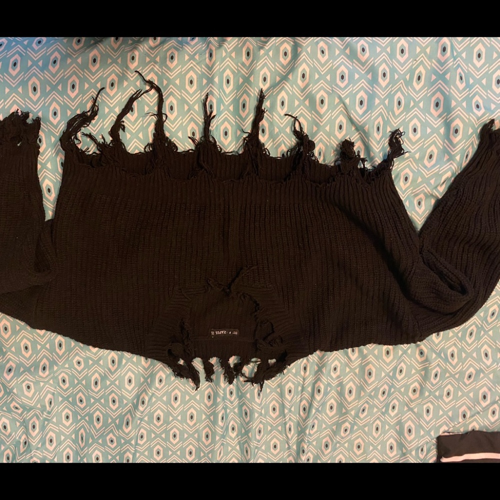 Cropped black sweater top.